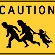Migrants crossing sign near Mexican border